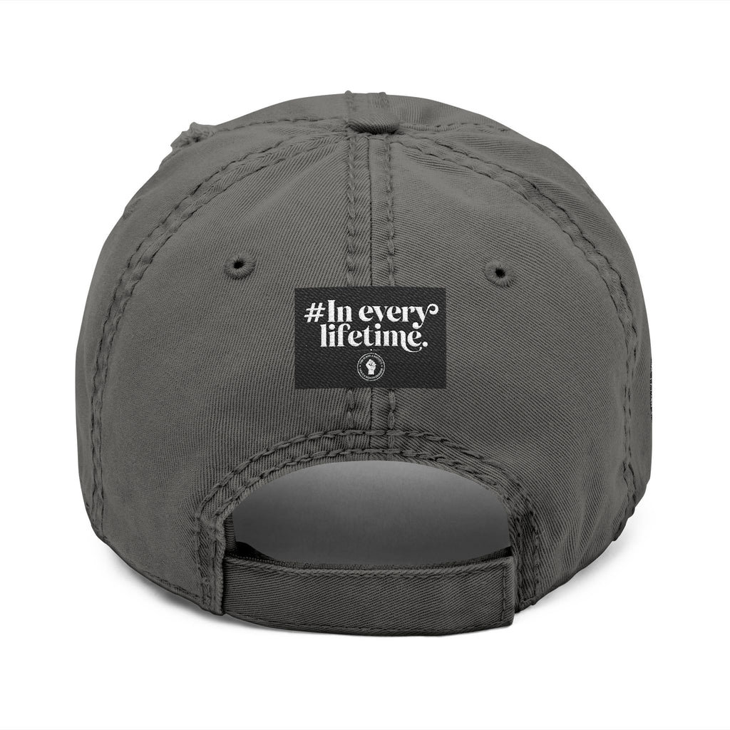 Distressed Embroidered Dad Hat — Raised Fist Emblem, “In Every Lifetime” Back Tag
