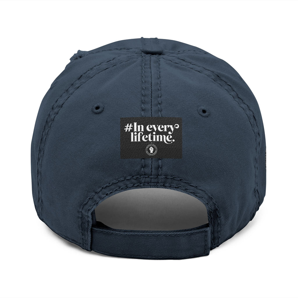 Distressed Embroidered Dad Hat — Raised Fist Emblem, “In Every Lifetime” Back Tag